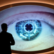 A man watches a screen that shows an eye being scanned at the new spy museum in Oberhausen, Germany.